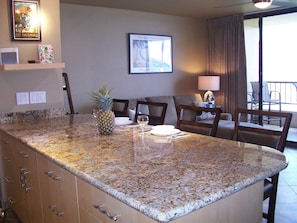 Oversize Granite island with 4 comfortable bar stools for all your meals.