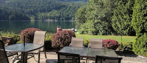 Patio with firepit visible on left side; dock for swimming; lots of privacy.