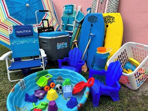 Beach cart, umbrellas, beach chairs, cooler, body boards, sand toys galore!
