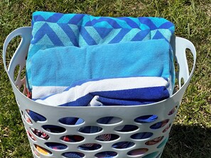 Top quality clean colorful beach towels in abundance at Dolphin Cottage.