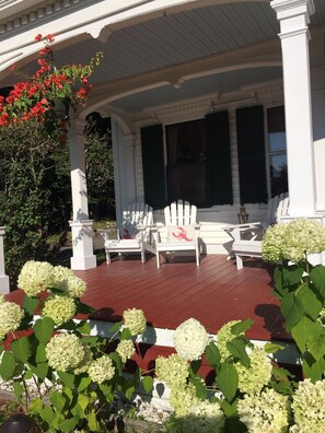 The front porch.  My favorite place for a glass of wine at sunset!