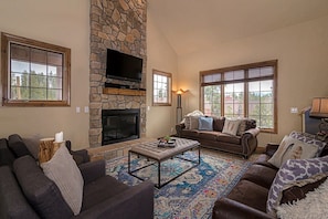 Relax and enjoy the gas fireplace and flat screen TV. Sleeper sofa in this family room as well.