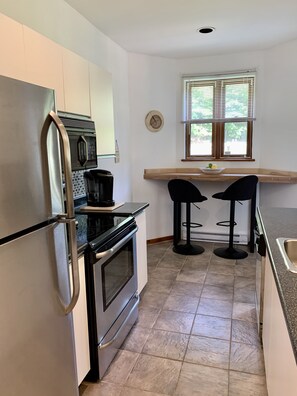 Kitchen view with stainless steel appliances and dishwasher