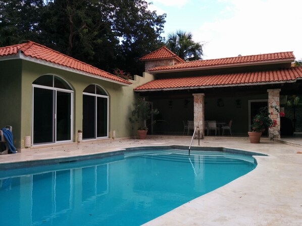 Pool Area. Sitting area  with access from Guest House through Sliding Doors.