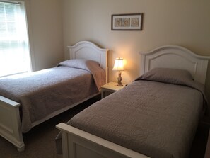 TWO TWIN BEDS.  BRAND NEW FURNITURE AND MATTRESSES.  