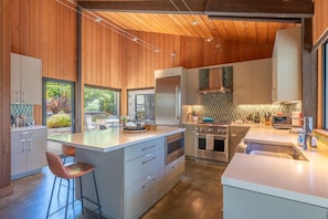 Kitchen area provides ample seating to watch the hummingbirds in the courtyard