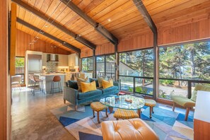 Open style kitchen and TV room with front deck access