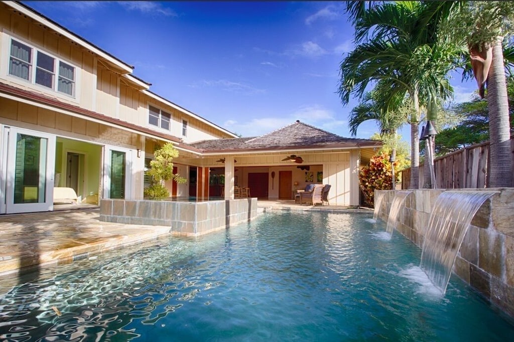 Luxurious backyard with pool & spa at this Kailua place to stay on Oahu