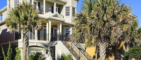 Front of home with patios on 2nd and 3rd floors facing ocean