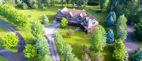 Aerial View of Spring Creek Estate.  2 acres and trout pond and huge flat yard