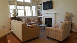 Living room with flat screen TV and ample seating