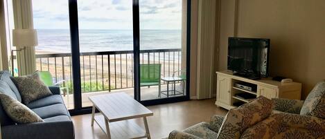 living room with view of the beach and ocean
