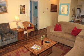 Newly installed wood floors and beachy theme furnishings.
