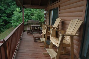 Wrap around deck on main living area with picnic table. 
