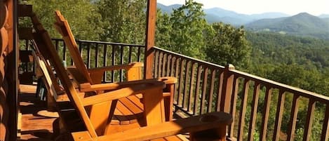 Tall adirondack chairs to see over railing.