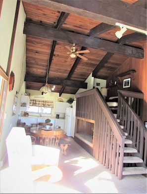 Long view from living room, dinning table to the kitchen.