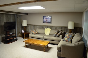 Walk in level sitting area with TV.