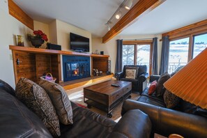 Living room overlooking the slopes. Fireplace will be gas by winter 2024