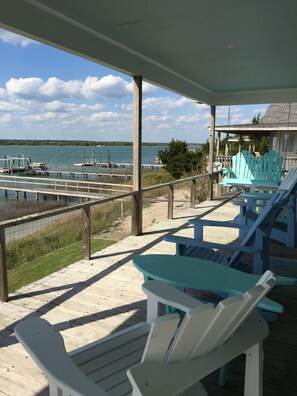 Cottage porch has comfortable seating to enjoy the view! Come swing awhile!