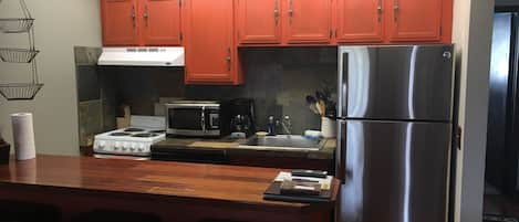 Kitchen with all necessary cooking utensils and cookware.