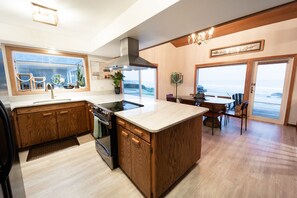 Open kitchen, perfect for entertaining, with dining room seating for 8-10