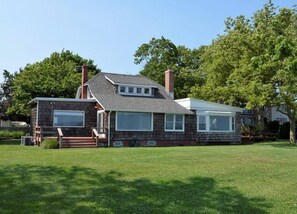 View of the back of the house from beach.  Direct water views from all windows.