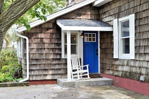 Front door with shaded patio area