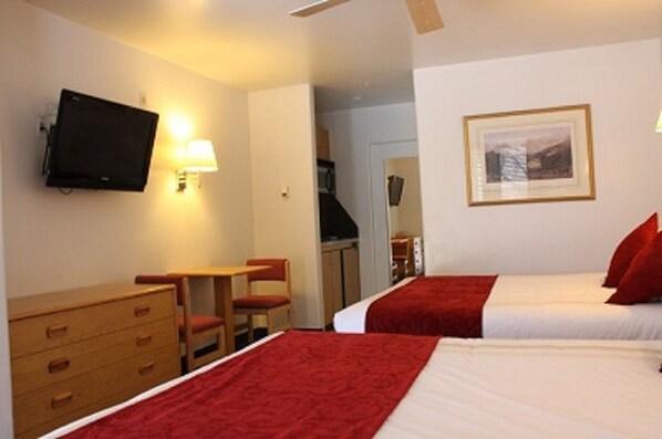 Room/kitchenette with 2 queen beds. Wall Kitchenette unit. Marble Bathroom.