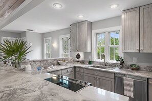 Stone kitchen- fridge, stove/oven, dishwasher, microwave, coffee maker, blender