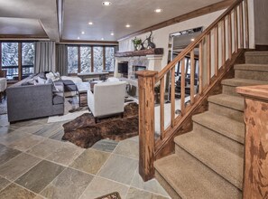 Standing in foyer looking into living area.  Colorado stone floors