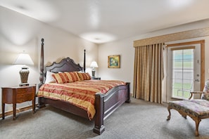 Master bedroom with king bed and walk out patio