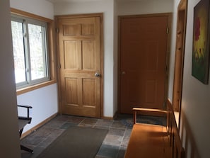 Entry/mudroom (solid wood door is private owners suite)