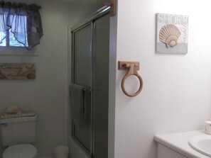 Bathroom with tub/shower and Laundry