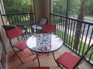 Seating for 6 outside the screened patio . Bird watching and very peaceful .