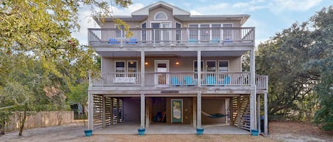 Nestled in the live oaks with parking for 5+ cars.