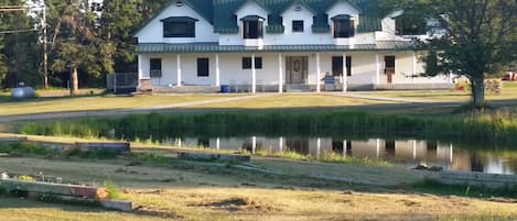 A small pond enhances the beauty of the property.