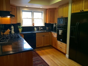 kitchen- granite counter tops and well stocked.