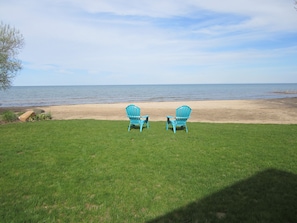 88' OF BEACH, NO CLIFF/STEPS, FIST SIZE ROCKS ON FLAT LAKE BOTTOM TO SANDBAR