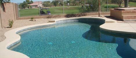 Pebble Tek pool with new Kool Deck with golf course behind.