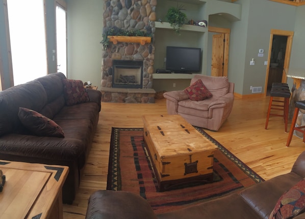 Great room, gas log fireplace, flat screen tv and new sleeper sofa and loveseat