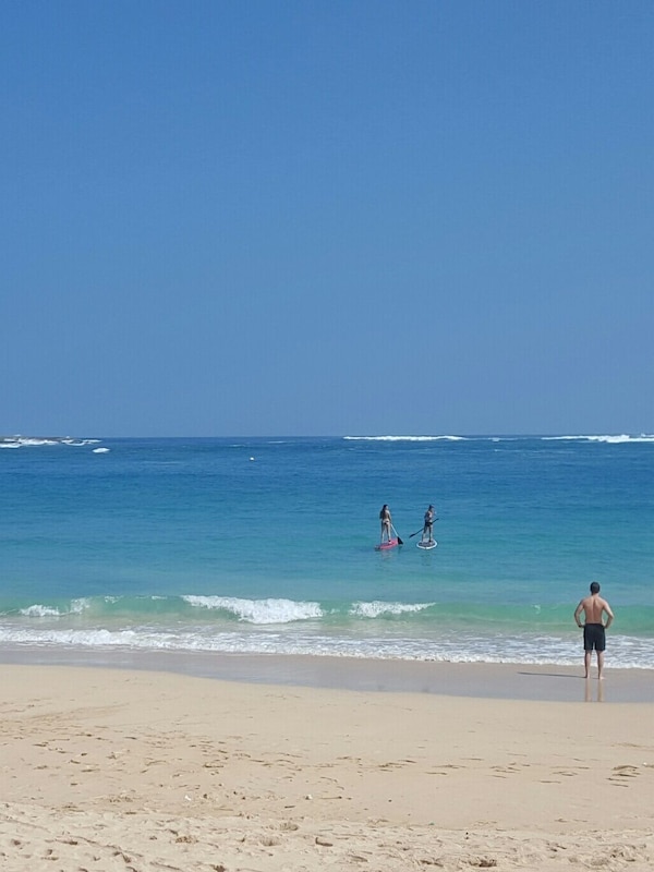 Paddling, surfing, snorkeling, swimming right at Hukilau