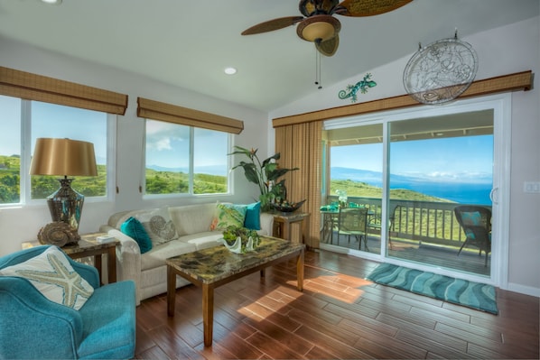 Living room with ocean, ranch, and volcano views