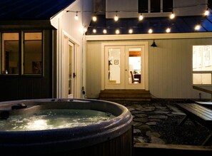 Enjoy the hot tub on the patio outside the living room