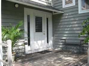 Charming front entryway welcomes you and your family...