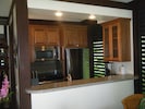 Brand new kitchen includes oven,refrigerator,microwave, dishwasher, and cookware