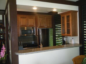 Brand new kitchen includes oven,refrigerator,microwave, dishwasher, and cookware