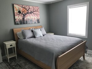 Another queen bedroom with  TV, lots of natural light and large closet