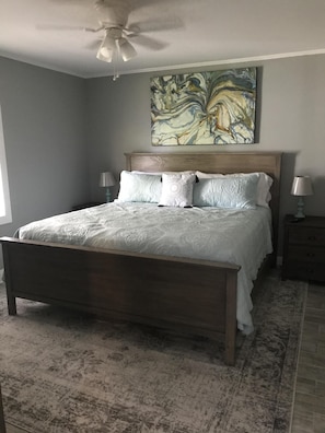 Master bedroom with king bed, large closet, natural light and TV