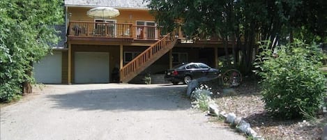 front view of house, extensive parking area, double oversize garage