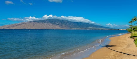Beach with view of West Maui Mountains. Bring water shoes as it can be rocky.
